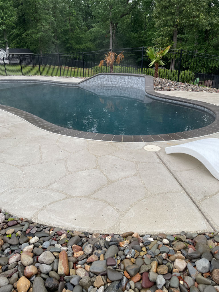 Clean pool deck and outdoor swimming pool area